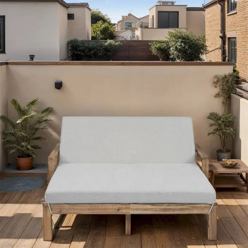 Lit de jour d'extérieur en bois monobloc avec coussins en tissu